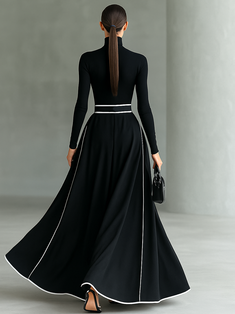 Martina – Abito maxi nero con cuciture bianche, collo alto, maniche lunghe e cintura
