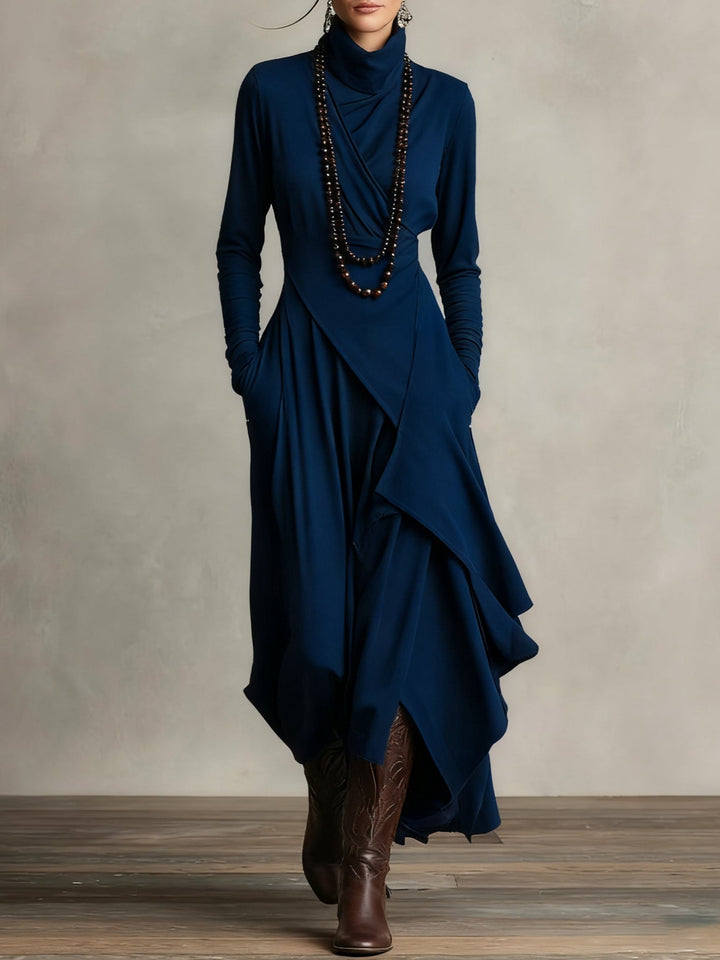 Sandra – Vestito maxi plissettato asimmetrico con collo alto viola