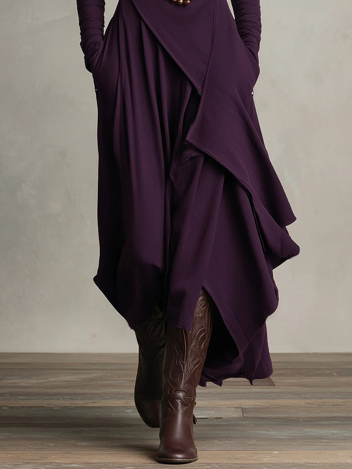 Sandra – Vestito maxi plissettato asimmetrico con collo alto viola